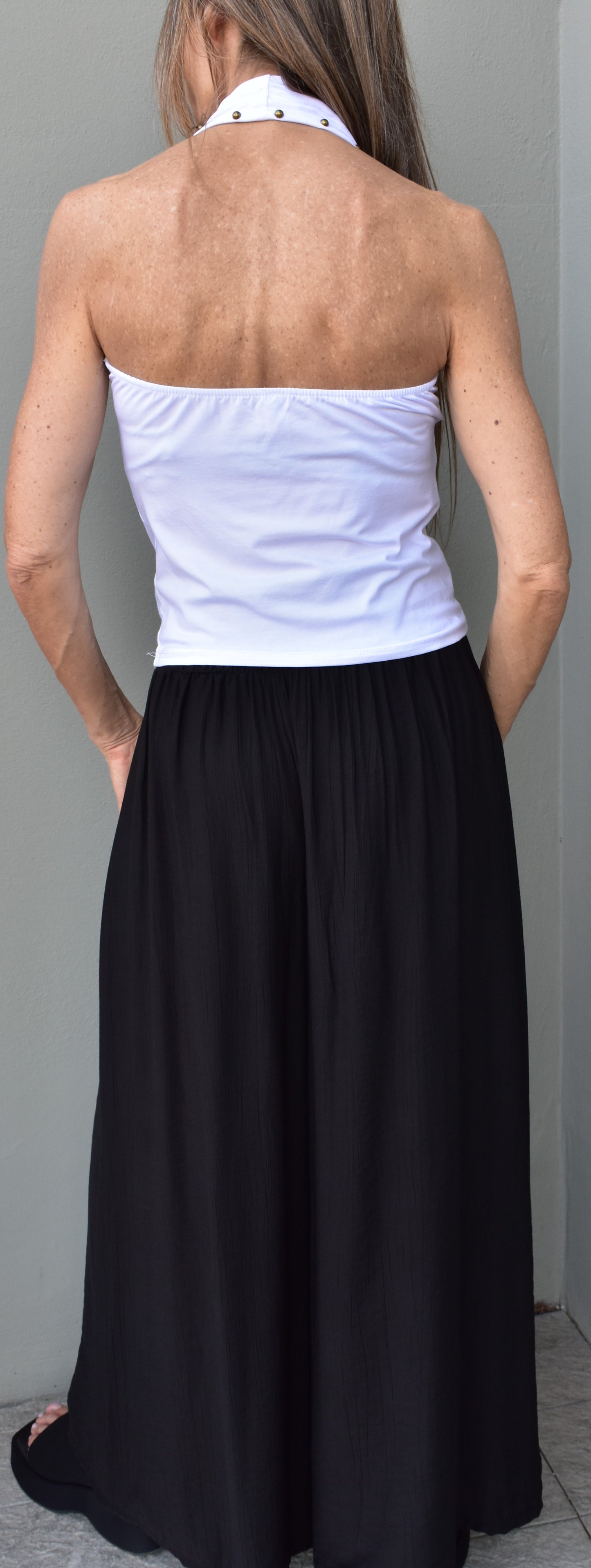 top borchie schiena nuda