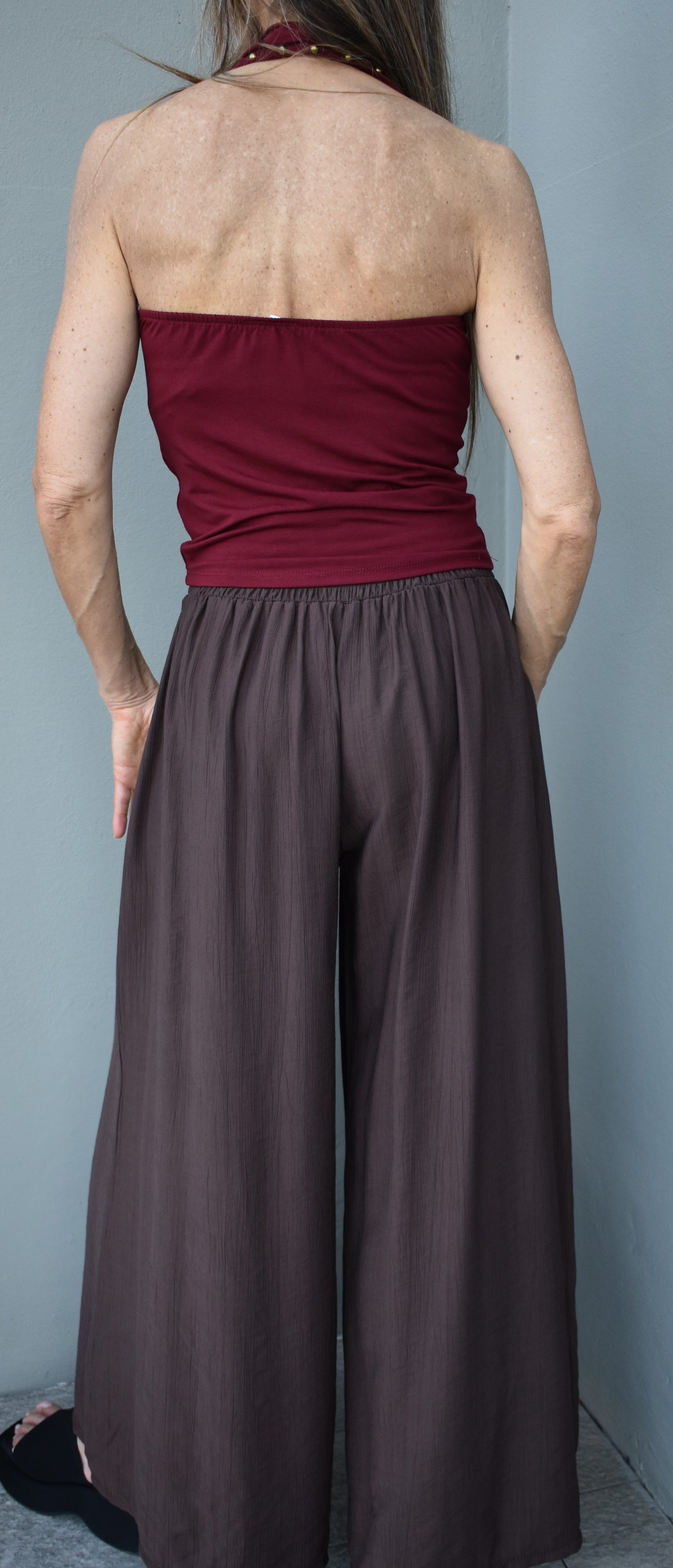 top borchie schiena nuda