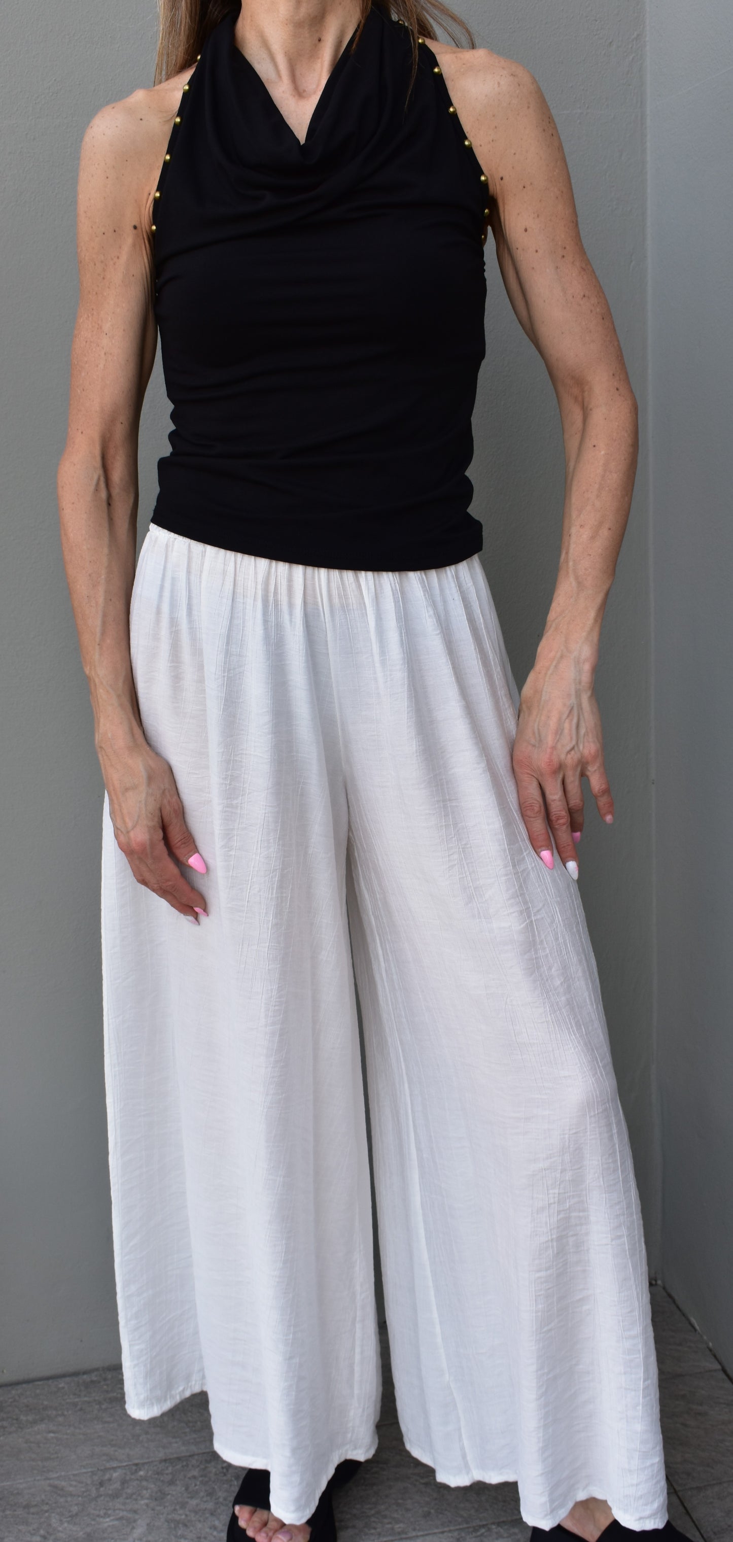 top borchie schiena nuda